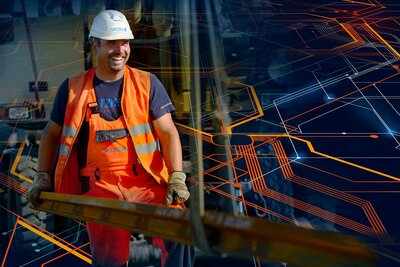 Arbeiter mit Siganlkleindung bei Gleisbauarbeiten